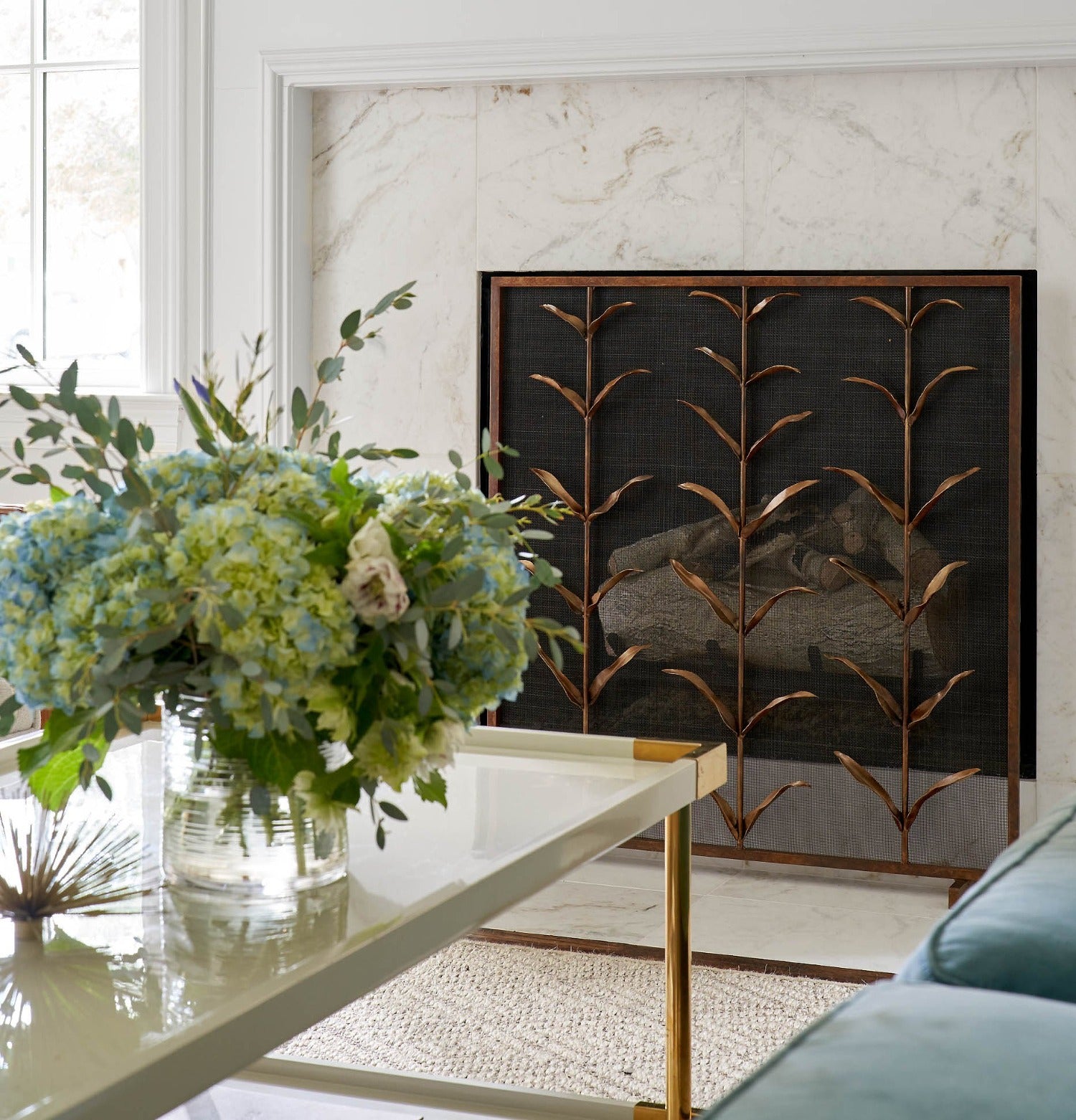 Lily Stems Fireplace Screen lifestyle image with Hydrangea Floral Arrangement 