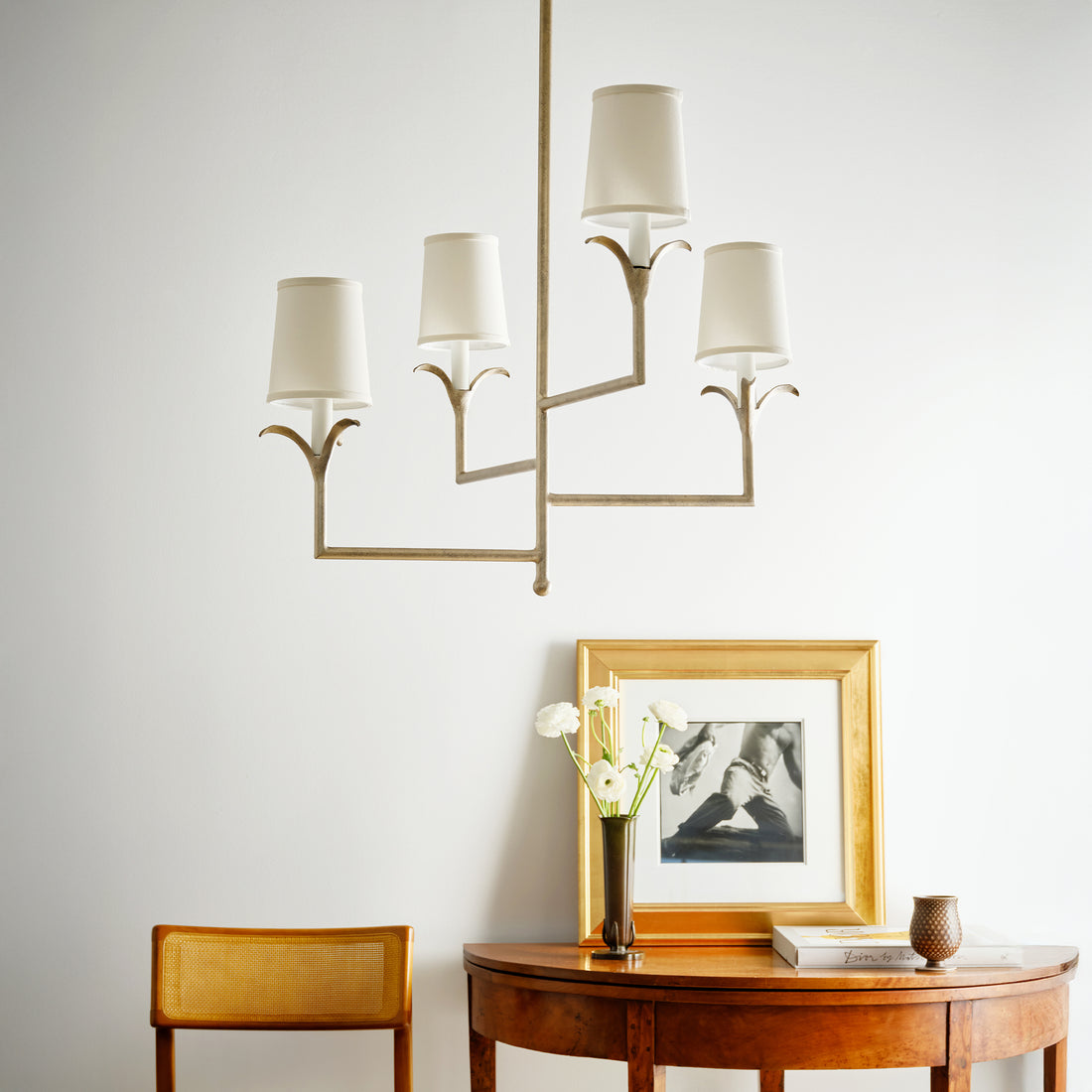 Elegant lily stems chandelier on a modern geometric frame. Luxury lighting fixture for contemporary settings.